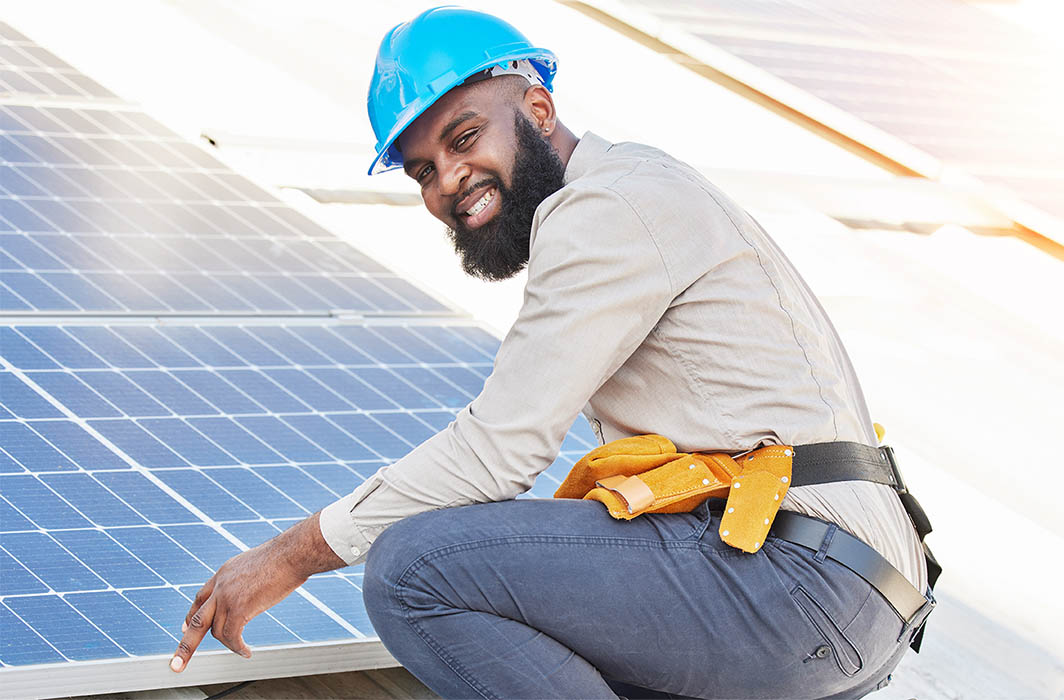 man installing solar panels man installing solar panels
